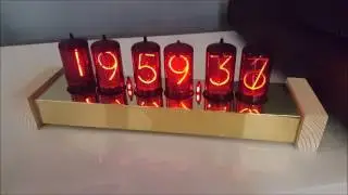 Z566M nixie clock with crossfade effect in brass & wood case.