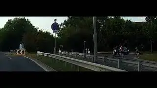 Near miss between motorbike and pedestrians at roundabout on the A149 Caister Norfolk England 3.7.25