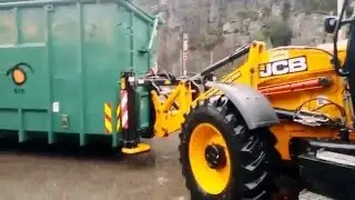 Waste Master pulling Containers