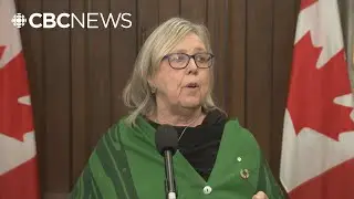 May says she'll vote yes on budget after PM commits to Paris climate targets