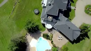 Aerial view of big house and golf course at Val David available for movie rental.