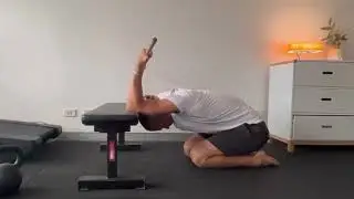 Bench assisted thoracic extension mobility with lat and tricep stretch.