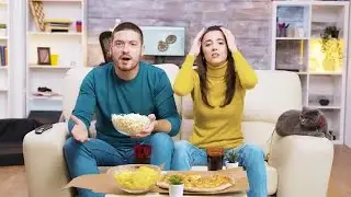 Excited Couple Watching TV Stock Video
