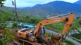 Dangerous Job: Hitachi Excavator Digging Rock Dirt at Hilly Road Corner