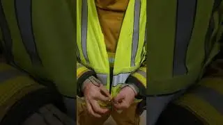 zipping up a traffic safety vest properly