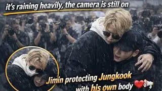 “it's raining heavily, the camera is still on-Jimin is protecting Jungkook with his own body 🌧️❤️”