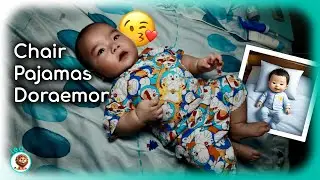 Leo lounges like a king on his inflatable throne, then struts around in his fresh Doraemon PJs