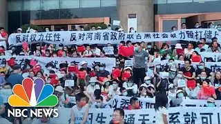 Chinese Security Personnel Clash With Protesters Outside Bank