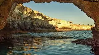 ATMOSPHERE OF A SEASIDE CAVE ON THE SUMMER BEACH. THE SOUND OF WAVES FOR RELAX.