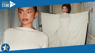 Kylie Jenner sizzles in a curve-hugging white dress with dramatic cape at Paris Fashion Week164 2738