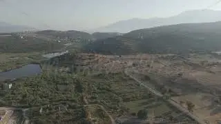 D-Log M. Gelemis, Turkey. Ancient gate, modern roadway and Hurmalik Hamami thermal complex at Tep...