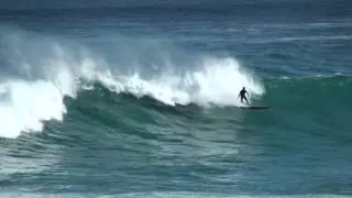 Margaret River Mouth - Surfer paddles out and catches wave