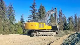 Loading Caterpillar 745 haul trucks with Deere 470g excavator and 5 yard bucket.