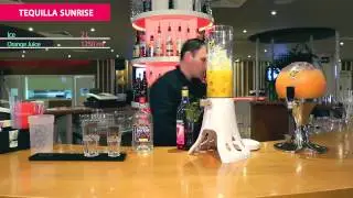 Tequilla Sunrise cocktail in beer tower