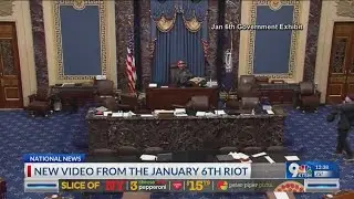 A new video released by government shows a man in the senate chamber on Jan. 6 riot.