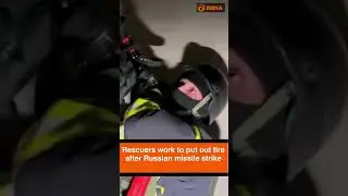 Rescuers work to put out fire after Russian missile strike
