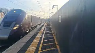 New 5 car EMR Class 810 Aurora passes Harlington station at full speed