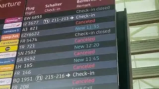 Scenes from Berlin airport as widespread technology outage disrupts flights around the world