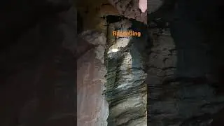 rappelling in a cave