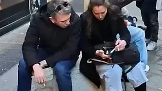 An Italian man and woman smoke cigarettes and crush the cigarettes and throw them away.