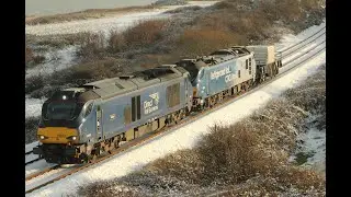 68007 and 88010 speed through the snow at Dawdon with a flask