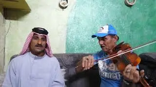المطرب علاء العجيلي مع عازف الكمان حميد الدراجي