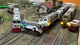 A long-distance Indonesian train derailed after hitting a small Transjakarta bus, causing it to r...