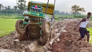 Rescue Operation: John Deere's tractor is stuck in the mud, and JCB comes to the rescue. #jcb