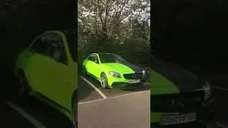 Lime green and matte black split wrap on a C63 AMG