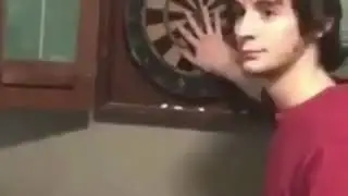 Guy takes a dart to his forehead like a boss
