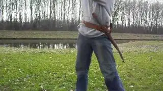 arrow shooting one-handed pistol and one handed mace
