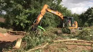 Case excavator digging out flood defences in Southwell Nottingham