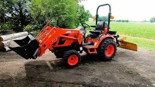 Kioti CX2510 Compact Tractor and Woods 3-point Blade