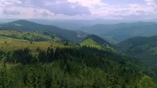 Aerial Drone Footage Flight Over Mountain Road Over Trees