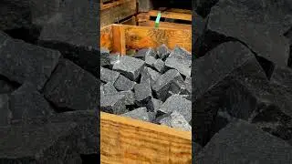 Black 100mm x 100mm x 50mm natural split finish granite setts.