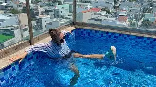 Wetlook video in the pool. Lulu get wet in full clothes and Nike sneakers