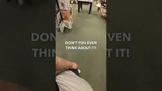 Woman kicking at her barking service dog in quiet bookstore 🤨