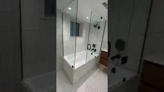 Custom glass bathtub enclosure with Matte Black hardware