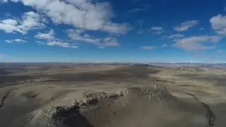 Overhead drone flight over Priest Butte in 4K resolution.