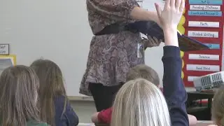 Teachers back at work, but union says pay is too low