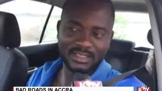 BAD ROADS IN ACCRA: Young men charge 10 Ghana Cedis to help pull out cars from 'pond'