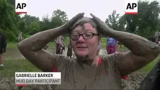 Hundreds of kids and adults got down and dirty at the 26th annual Mud Day held in a suburban Detroit