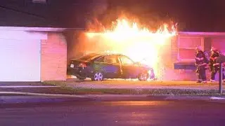 Car crashes into house in Sycamore Township, catches fire