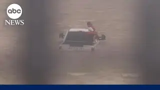 Watch moment firefighters work to rescue driver caught in flood brought by Beryl