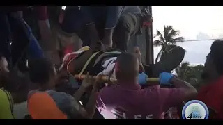 EMERGENCY CREW FREES MAN PINNED IN VIEUX-FORT CONTAINER