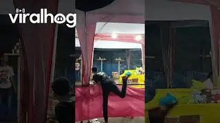 Carnival Game Player Falls Over Railing || ViralHog