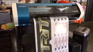 Time lapse of Roland BN-20 printing carbon fiber race graphic