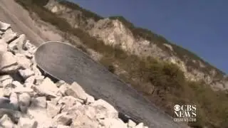 Skiers hit snowless slopes covered in stone