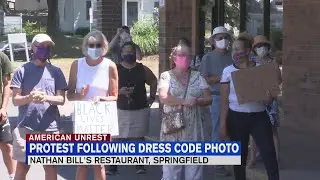 Springfield residents gather outside Nathan Bill's to protest against dress code sign
