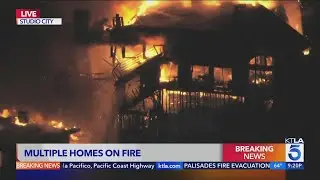 Four-story structure fire knocked down in Studio City after flames spread to nearby hillside homes